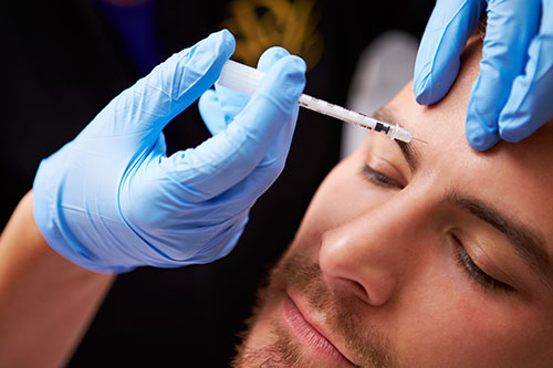 Man Having Cosmetic Injection Treatment